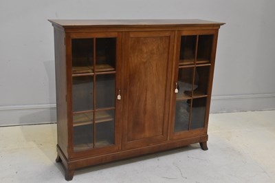 Lot 128 - A walnut display cabinet with two glazed doors...