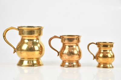 Lot 1196 - A graduated set of three 19th century brass...