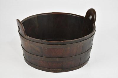 Lot 1085 - A metal bound stained wooden bucket, width 30cm.