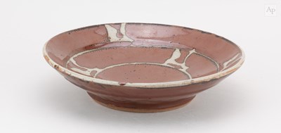 Lot 650 - SHINSAKU HAMADA (1929-2023) a stoneware dish...