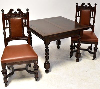Lot 18 - A 1930s oak square-topped extending dining...