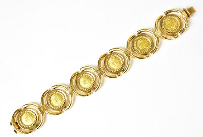 Lot 851 - An 18ct gold bracelet set with six 21.6ct gold...