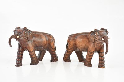 Lot 1698 - A pair of Japanese carved wooden elephants...