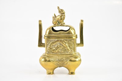 Lot 1680 - A Japanese twin handled brass koro and cover,...