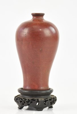 Lot 1590 - A Chinese copper red glazed meiping shaped...