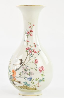 Lot 1588 - A Chinese Famille Rose bottle vase, decorated...