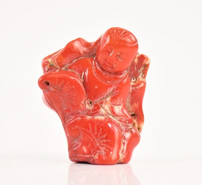 Lot 1642 - A carved coral figure, height 4cm.