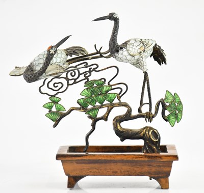 Lot 1702 - A Japanese white metal and enamel model of two...