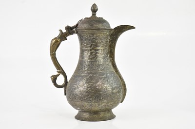 Lot 1721 - A Turkish Ottoman style cast metal coffee pot,...