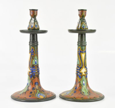 Lot 1889 - GOUDA; a large pair of candlesticks with...