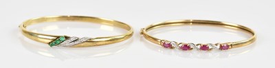 Lot 1193 - A 9ct yellow gold diamond set hinged snap...