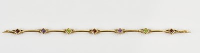 Lot 1237 - A 9ct yellow gold multigem set bracelet, with...