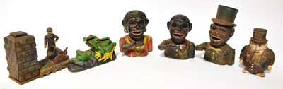 Lot 253 - A quantity of cast metal money banks, to...