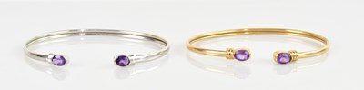 Lot 1219 - A 9ct white gold amethyst set bangle and a...
