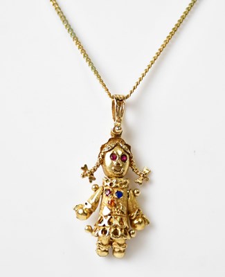 Lot 896 - A 9ct yellow gold articulated doll pendant set...