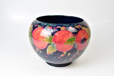 Lot 114 - MOORCROFT; a 'Pomegranate' pattern jardinière...