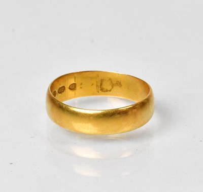 Lot 785 - A 22ct gold wedding band, size K1/2, approx. 2....