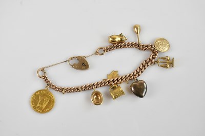 Lot 1103 - A 9ct flat link Albert chain with a 9ct gold...