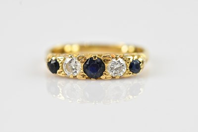 Lot 2506 - A yellow metal diamond and sapphire five stone...