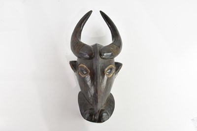 Lot 1534 - An African carved mask of a water buffalo,...