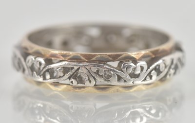 Lot 1338 - A 9ct gold two colour band ring, the central...