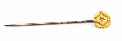 Lot 1474 - A stick pin with 15ct gold head centred with a...