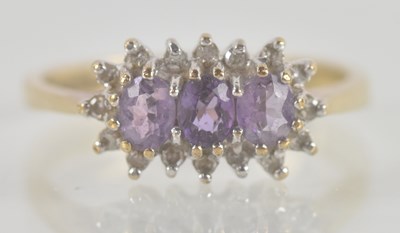 Lot 1355 - A 9ct yellow gold amethyst and white stone set...