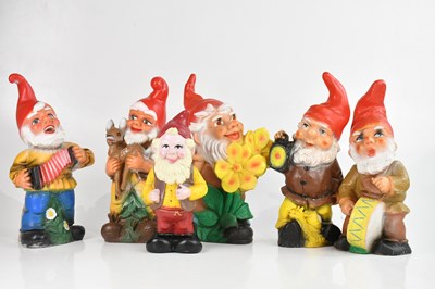 Lot 2215 - A collection of six plastic garden gnomes,...