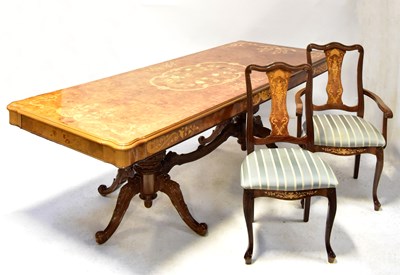 Lot 55 - A Sorrento marquetry inlaid walnut dining...