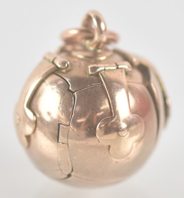 Lot 1387 - A 9ct yellow gold Masonic orb pendant with...