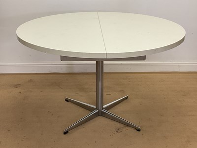 Lot 938 - PASTOE; a 1970s circular extending dining...