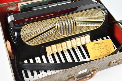 Lot 1342 - HOHNER; a piano accordion, cased.