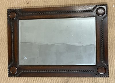 Lot 933 - An oak wall hanging mirror, with beaded...