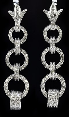 Lot 1478 - A pair of white metal and diamond Art Deco...