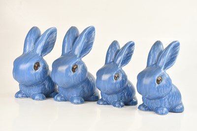Lot 1347 - SYLVAC; a group of four blue rabbits, largest...