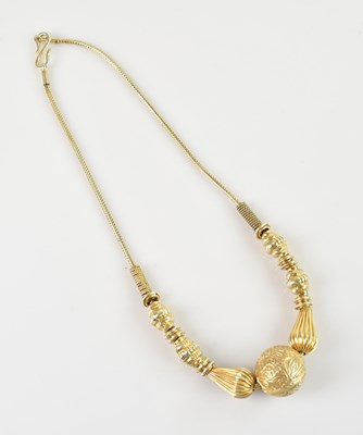 Lot 1017 - An eastern sterling silver gilt necklace,...