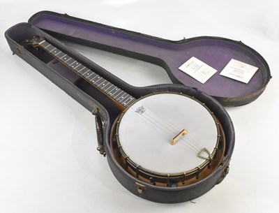 Lot 1399 - JOHN GREY & SONS; a cased four string banjo.