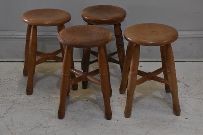 Lot 2086 - A set of three circular stools and another...