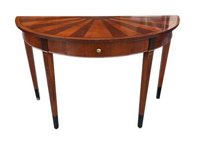 Lot 169 - A reproduction demi-lune single drawer console...