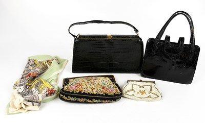 Lot 719 - A green vintage crocodile skin leather handbag,...