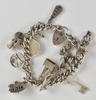Lot 1509 - A 925 silver charm bracelet including boat,...