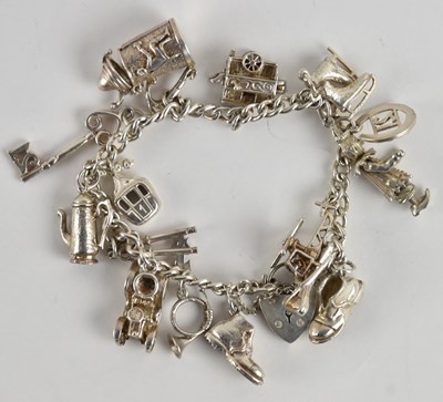 Lot 1507 - A 925 silver charm bracelet including shoe,...