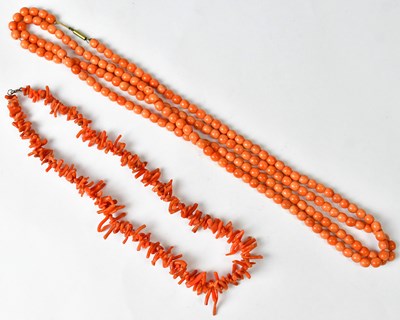 Lot 927 - Two pink coral necklaces (2).