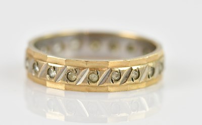 Lot 2587 - A hallmarked silver and yellow metal band, set...