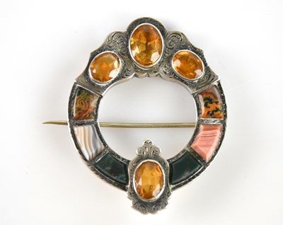 Lot 1349 - A Scottish white metal brooch, set with agate...