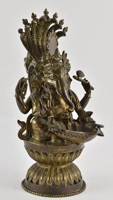 Lot 1026 - A 19th century bronze figural oil lamp...