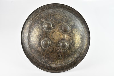 Lot 577 - An Indo-Persian dhal shield, decorated...