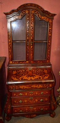 Lot 1563 - A reproduction Dutch marquetry inlaid bureau bookcase