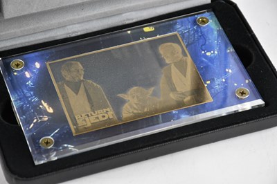Lot 1599 - STAR WARS TRILOGY; a cased 24ct gold card,...