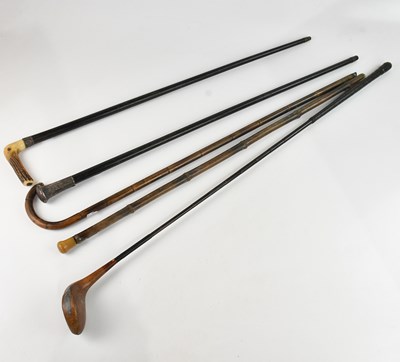 Lot 2231 - An ebony and white metal walking stick, a horn...